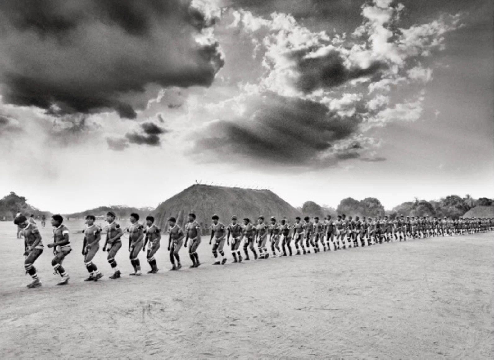 Sebastião Salgado, Kuikuro warriors parade during Kuarup festival, Xingu Indigenous Territory (L) Sebastião Salgado, Kuikuro warriors parade during Kuarup festival, Xingu Indigenous Territory (L)